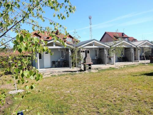 a house with a yard in front of it at New holiday homes for 2 people in Dziwn wek in Dziwnówek