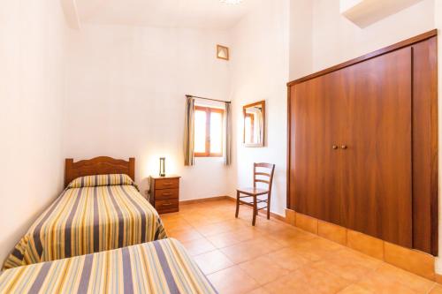Ένα ή περισσότερα κρεβάτια σε δωμάτιο στο Residence Praia di Fuoco
