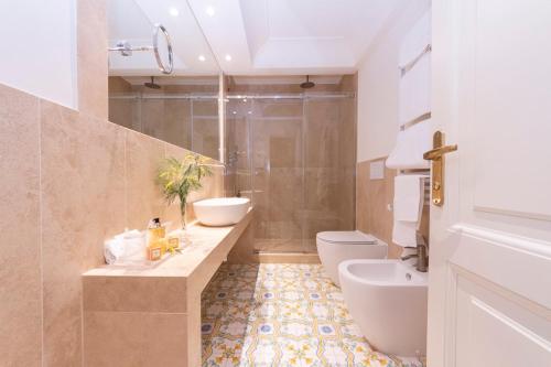 a bathroom with a sink and a toilet and a shower at Park Hotel Villa Grazioli in Grottaferrata