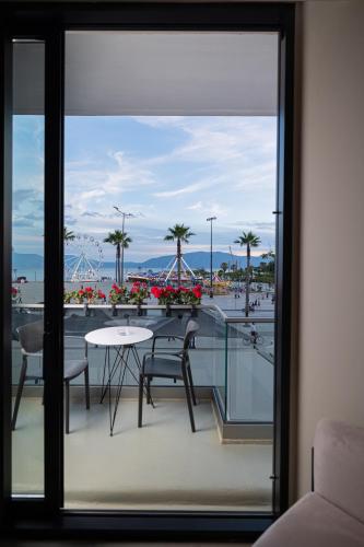 a view from the balcony of a hotel with a table and chairs at Dot Tradition in Vlorë
