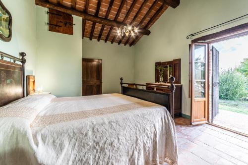 Postel nebo postele na pokoji v ubytování Il Querciolo - Azienda biologica, Agriturismo e Cantina