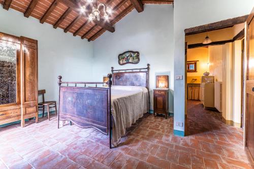 Postel nebo postele na pokoji v ubytování Il Querciolo - Azienda biologica, Agriturismo e Cantina