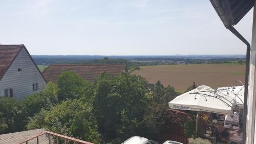 a view of a farm from the roof of a house at Restaurant und Hotel Alter Brunnen in Marloffstein