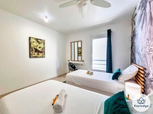 Katil atau katil-katil dalam bilik di T3 - Tropical Lodge - 3 étoiles - 65m2 - Saint-Pierre
