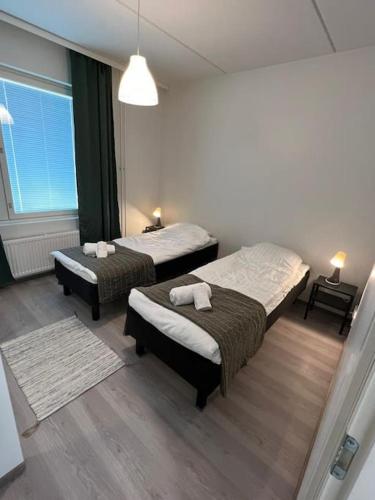 Postel nebo postele na pokoji v ubytování Kotimaailma - Kaunis 3MH asunto Pohjois-Haagassa