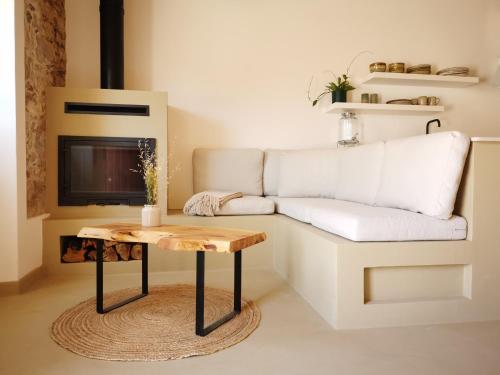 a living room with a couch and a table at AL MAR Guesthouse in São Luis