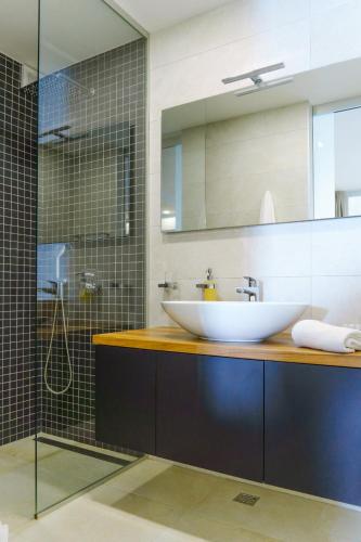 a bathroom with a sink and a shower at Apartments Bikin in Brela