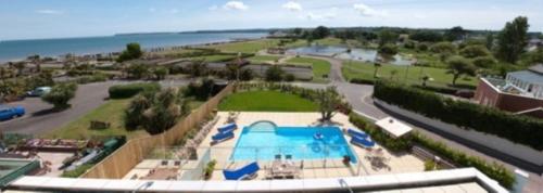 an aerial view of a resort with a swimming pool at Goodrington Lodge Holiday Apartments in Paignton