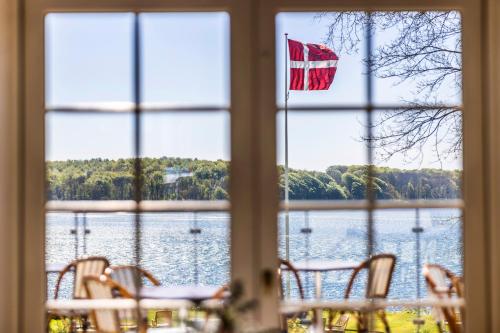 a window with a view of a body of water at Stella Maris in Svendborg