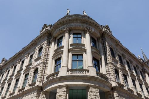 a large stone building with a round top at Rosewood Munich in Munich