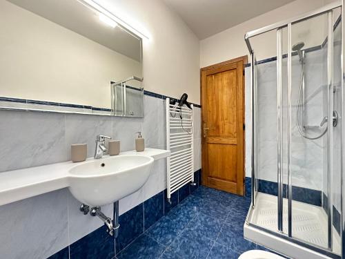 a bathroom with a sink and a shower at Luxurious View on Santa Croce in Florence