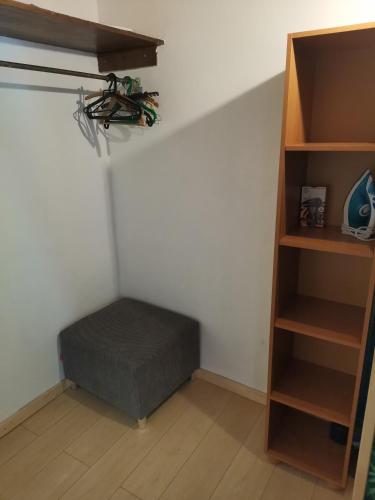 a room with a bed and a book shelf at Pod Papugami in Srebrna Góra