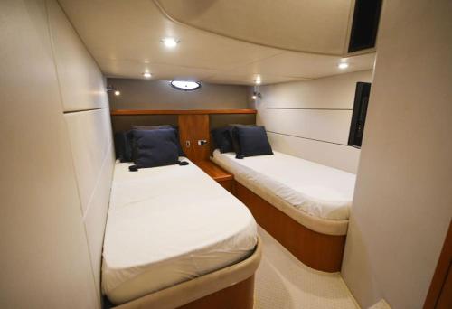 a small room with two beds on a boat at Special Yacht Rental in Gocek in Fethiye