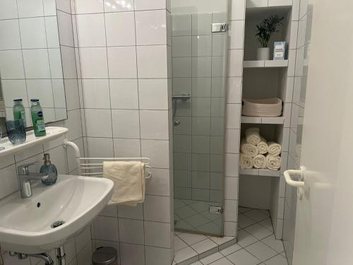 a bathroom with a shower and a sink at Ostsee Traum 