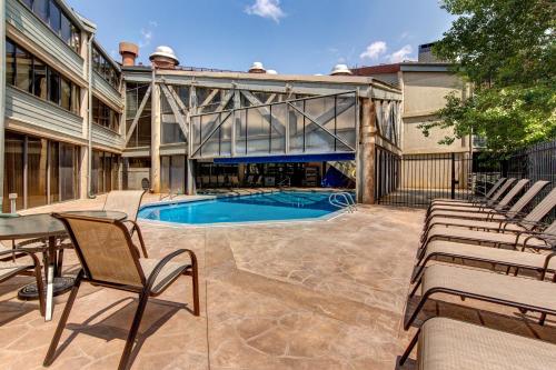 a patio with chairs and a swimming pool at Silver King & Prime Park City Condo in Park City