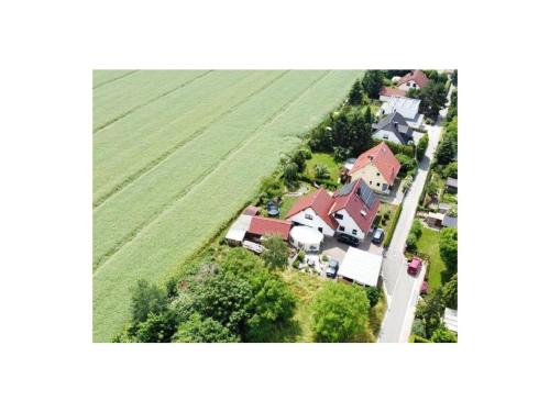 an aerial view of a house in a field at Ferienwohnung-Krohn in Großpösna