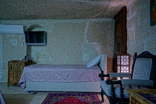 Cama o camas de una habitación en Holiday Cave Hotel