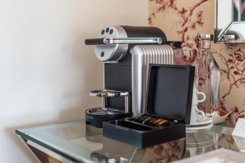 a coffee maker sitting on top of a glass table at Stella Maris in Svendborg
