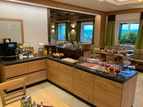 a restaurant with a buffet line with food on it at Landgasthof Entenwirt Tarsdorf in Tarsdorf