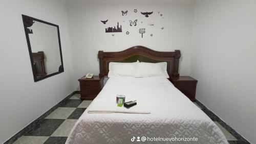 Llit o llits en una habitació de Hotel Nuevo Horizonte E.M.J