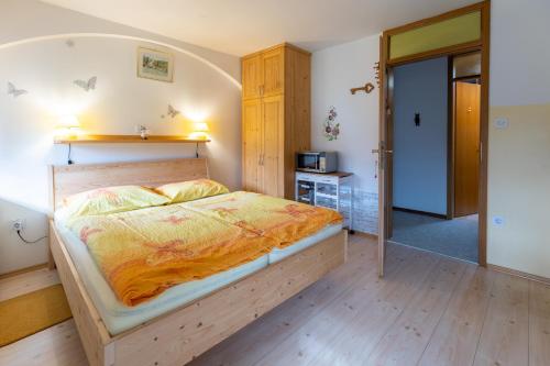 a bedroom with a bed in a room at Apartmaji Verica Ceklin in Bohinj