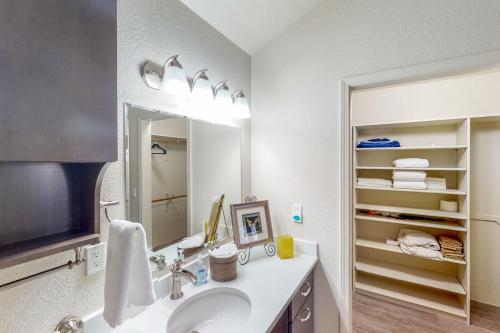 a bathroom with a sink and a mirror at Nanacitas Casita in Greeley