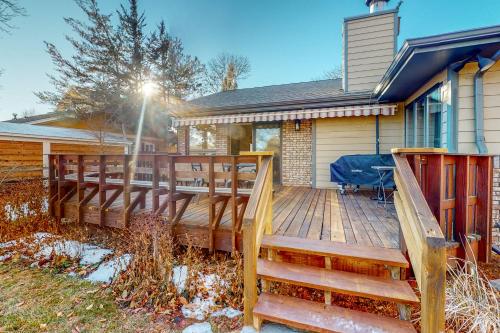 a large wooden deck in front of a house at Nanacitas Casita in Greeley