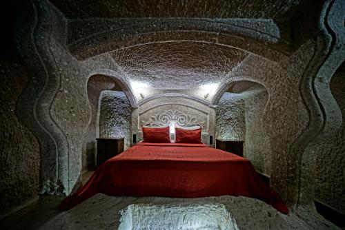 Cama o camas de una habitación en Holiday Cave Hotel