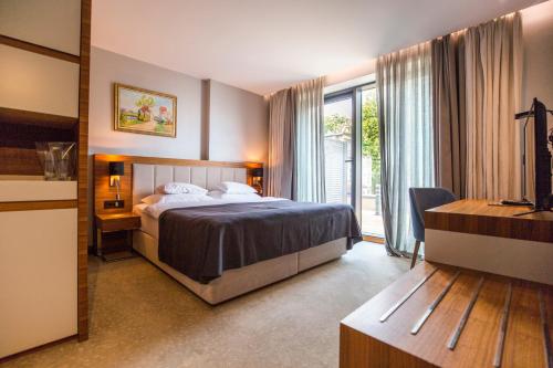Postel nebo postele na pokoji v ubytování Hotel Tonanti