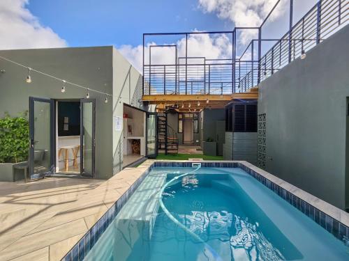 a swimming pool in the backyard of a house at Virginia Avenue Villas - Adriatica and Botanica in Cape Town