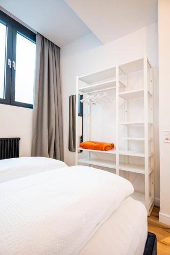 Ένα ή περισσότερα κρεβάτια σε δωμάτιο στο Apartments Leopold Ferdinand