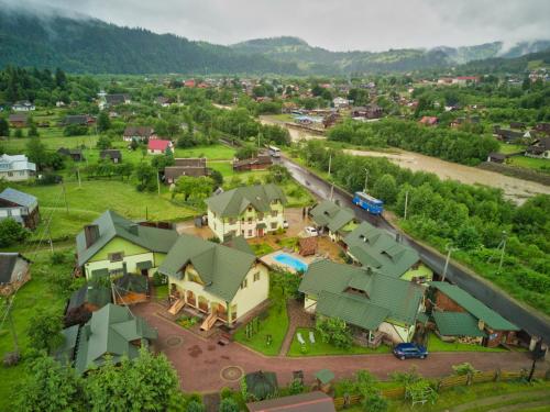 an aerial view of a small village with houses at Emerald House in Mykulychyn