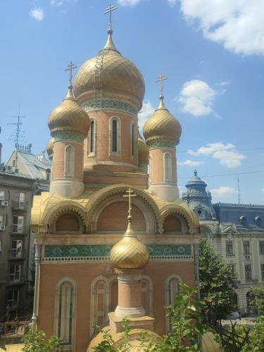 a large building with domes on top of it at The Moon Residence in Bucharest