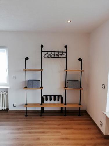 a room with three shelves on the wall at Ferienwohnung Entenquack in Weisel