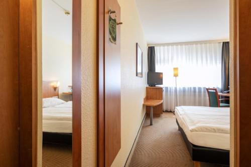 Postel nebo postele na pokoji v ubytování ACHAT Hotel Braunschweig