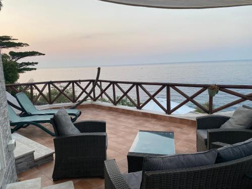 a balcony with chairs and a view of the ocean at Mare e cielo in Porticello