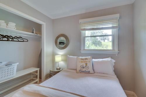 a bedroom with a bed with a pillow on it at Charlottesville Getaway in Baileys Retreat! in Crozet