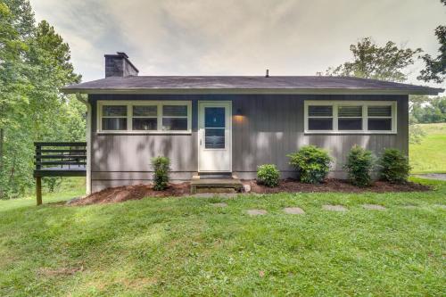 a small gray house with a blue door at Charlottesville Getaway in Baileys Retreat! in Crozet