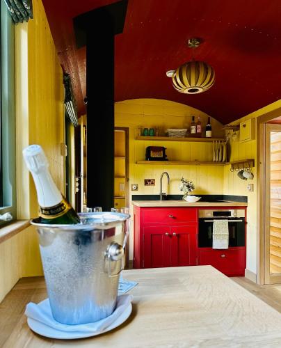 a bottle of wine in a bucket in a kitchen at Rufflets St Andrews in St. Andrews