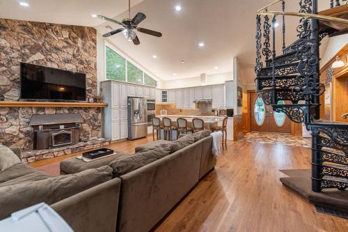 a large living room with a couch and a fireplace at Waterfront - Kawartha Lakes in Kawartha Lakes