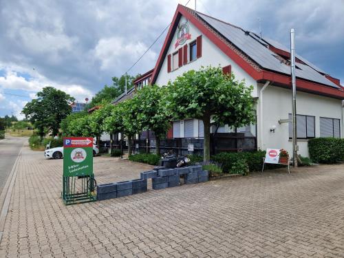 a building with a sign in front of it at Hotel Platzhirsch in Gaggenau