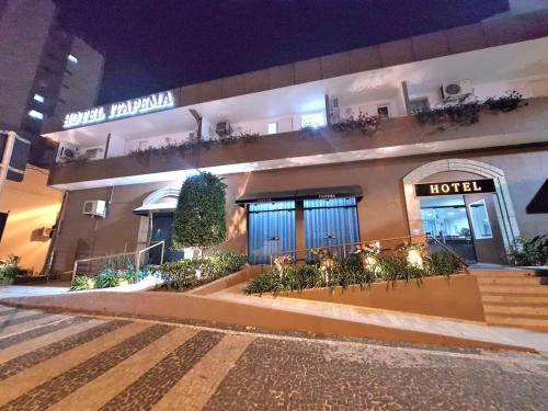 a hotel is lit up at night at Hotel Itapema in Valinhos