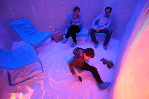 a young boy playing in a room covered in snow at Hotel Relais Valle Orientina in Pitigliano