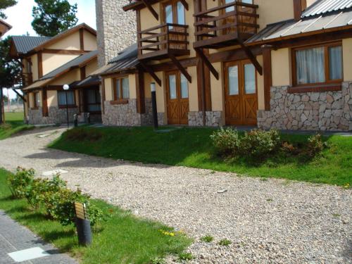 a large house with a pathway leading to it at Ayelen Andina in Esquel
