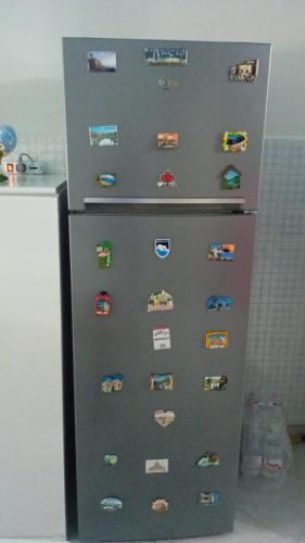 a refrigerator with magnets on the side of it at Il mondo di Leo in Tocco da Casauria