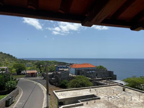 a view of a road and the ocean at Dunas De Areia Preta in Ribeira da Prata