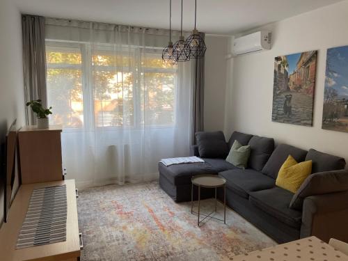 a living room with a couch and a table at COOKIE Apartment in Zagreb
