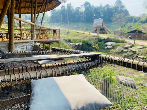 a group of blankets sitting on top of a fence at Daelorpu 2 แดลอปู in Ban Yang
