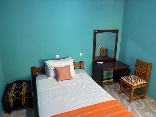 Postel nebo postele na pokoji v ubytování Lualemba Bungalow Resort