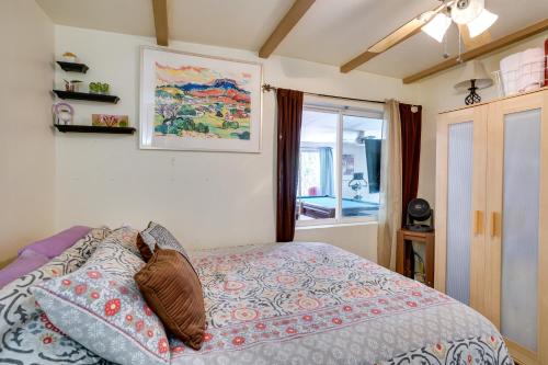 a bedroom with a bed with pillows and a window at Green Valley Vacation Rental Apt with Patio and Grill! in Green Valley